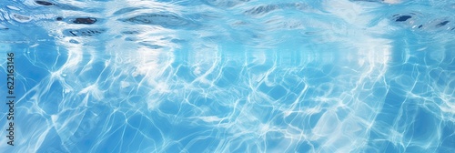 Clear water swimming pool background. Ripples and rings in the aqua liquid wallpaper. 