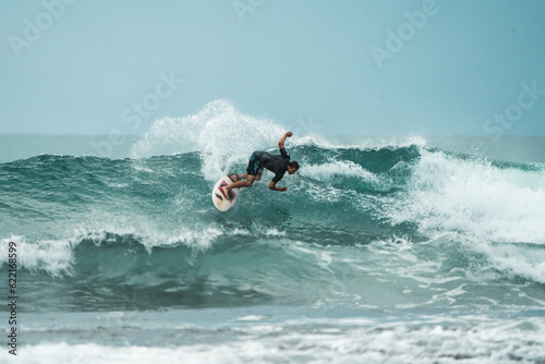 Sticker Indonesian Surfing Adventure: Thrilling Ride on Majestic Blue Waves in the Menta