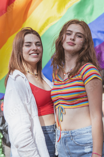 Caucasian pretty women holding a gay flag.