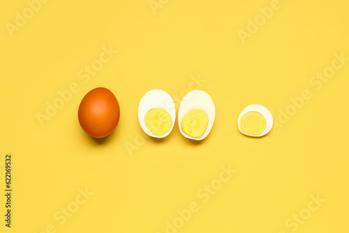 Whole brown egg and sliced ...