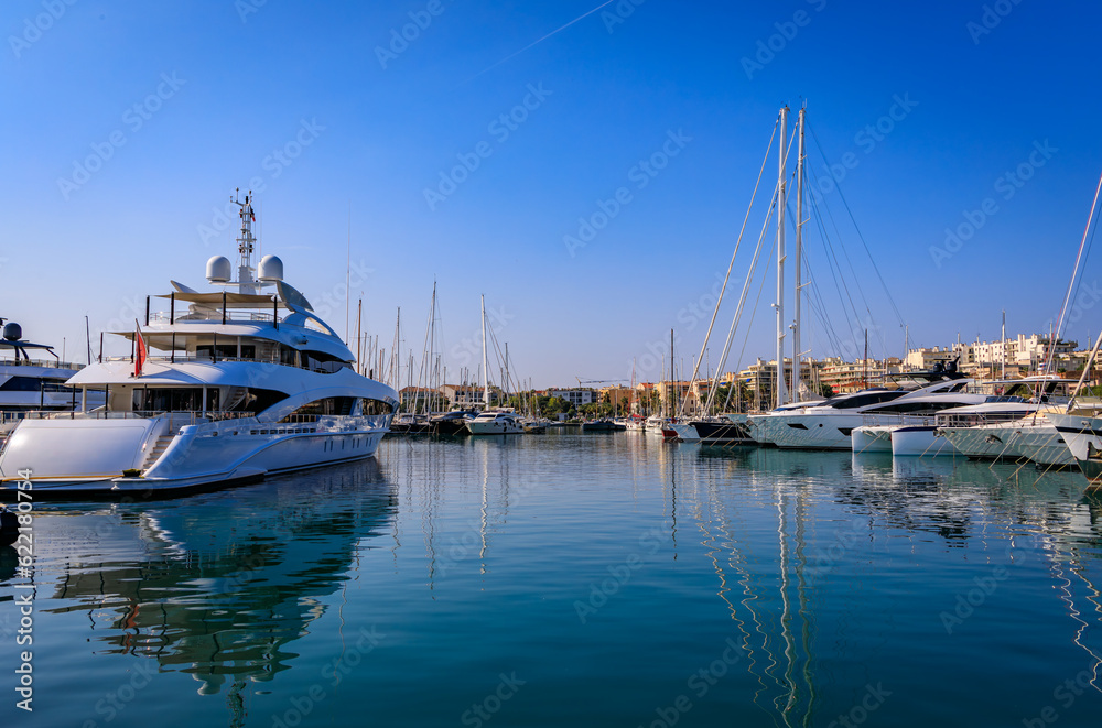 View onto the turquoise water of the Mediterranean Sea, luxury boats, yachts and coastline in Port Vauban, Antibes, South of France