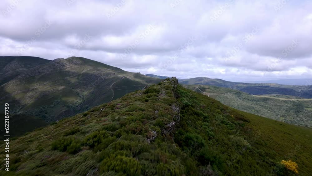 Aerial drone shot following a high trail in the mountains Aerial drone shot following a high trail in the mountains