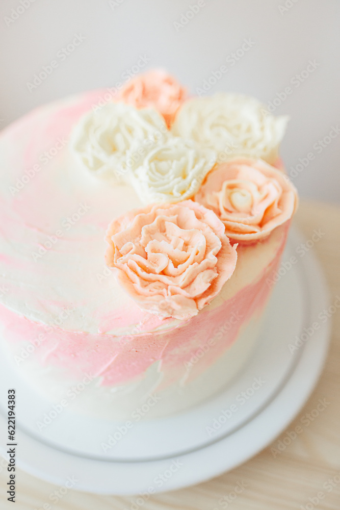 Birthday celebration for girl at home in light pink and gold colors. Birthday cake with flowers Birthday celebration for girl at home in light pink and gold colors. Birthday cake with flowers