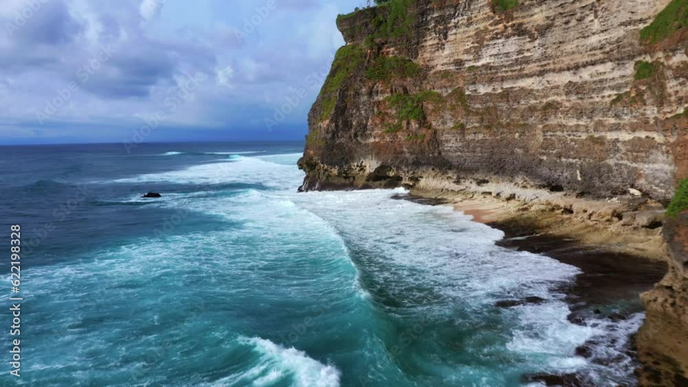 Uluwatu Sea Cliffs In Bali, Indonesia - drone shot Uluwatu Sea Cliffs In Bali, Indonesia - drone shot