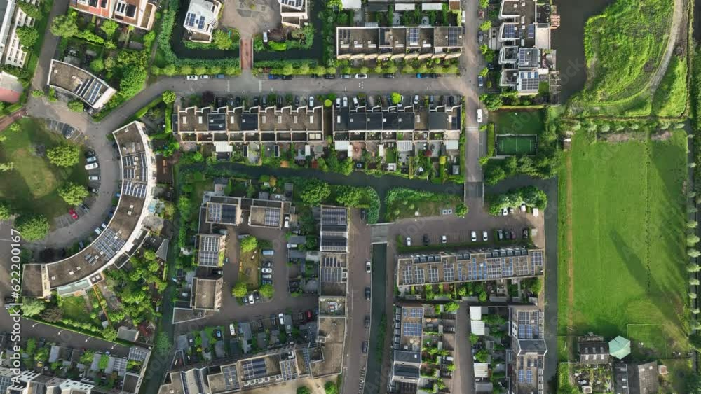 Eco friendly housing project in Amsterdam by canals, bird’s eye view Eco friendly housing project in Amsterdam by canals, bird’s eye view
