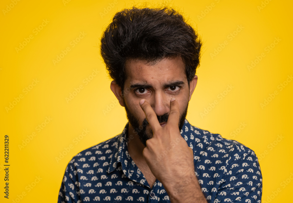 I am watching you. Young confident indian man pointing at his eyes and camera, show I am watching you gesture, spying on someone. Handsome bearded hindu guy isolated alone on yellow studio background I am watching you. Young confident indian man pointing at his eyes and camera, show I am watching you gesture, spying on someone. Handsome bearded hindu guy isolated alone on yellow studio background