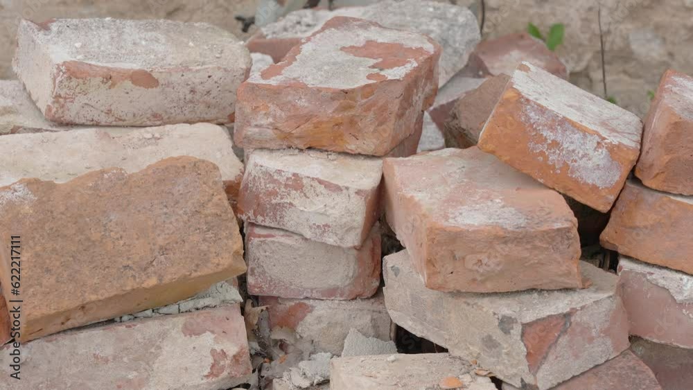 Closer look of the pile of bricks on the ground with the cement on it in Estonia Closer look of the pile of bricks on the ground with the cement on it in Estonia