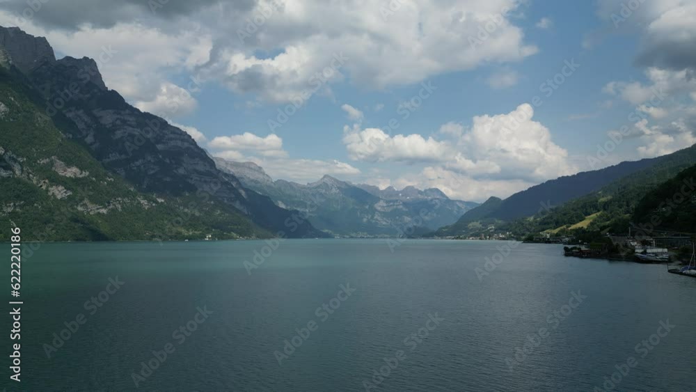 Dreamlike Switzerland landscape of cloudy horizon,mountain and calm lake Dreamlike Switzerland landscape of cloudy horizon,mountain and calm lake