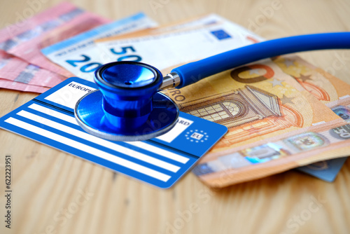European health insurance card, euros money, medical stethoscope, concept international Travel insurance EU and EFTA traveling, medical support on trip to Europe, healthcare coverage, peace of mind