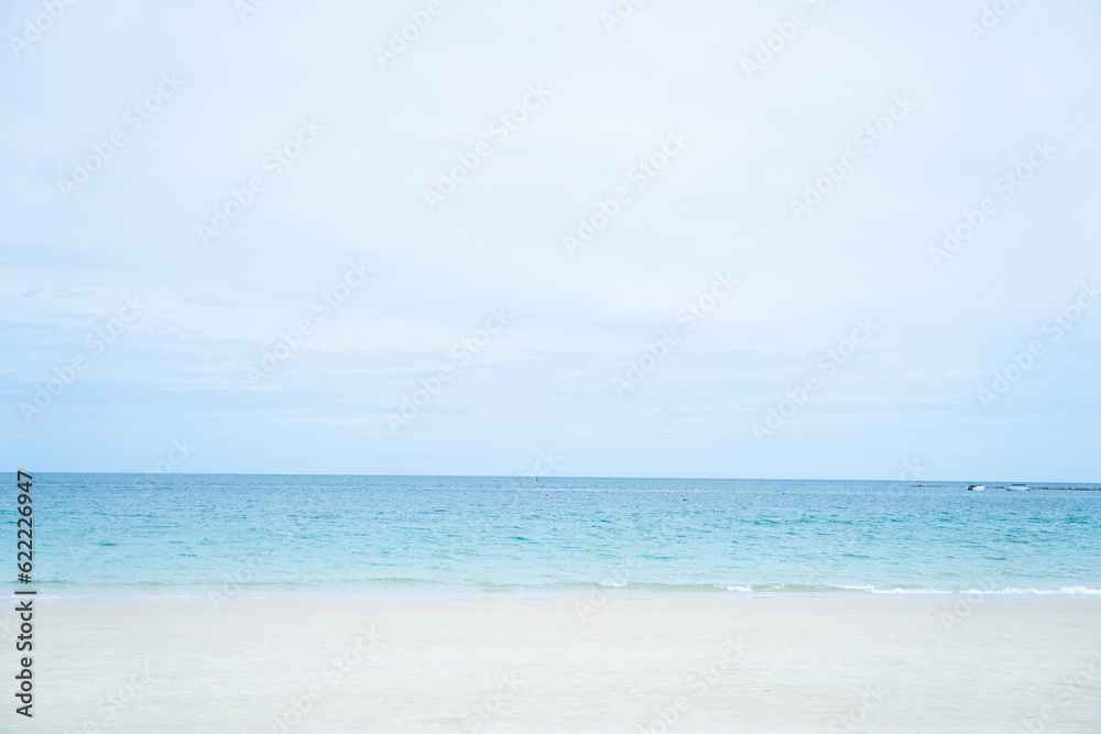 White beach and blue sky and clear water.