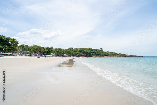 White sand beach with palm trees for tourist attractions and tropical holidays.
