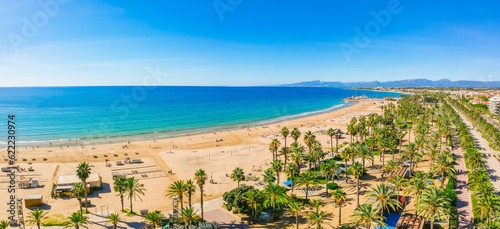 Beach, blue sea and palm trees in Salou city, Catalonia, Spain, Europe