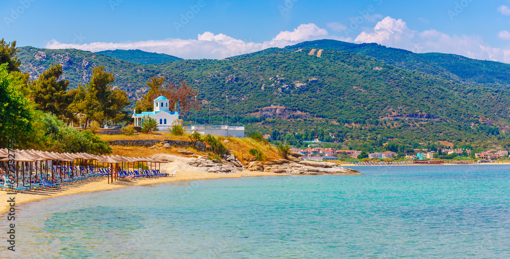 Beach and chirch near Kavala, Greece, Europe. Clear sand and blue water