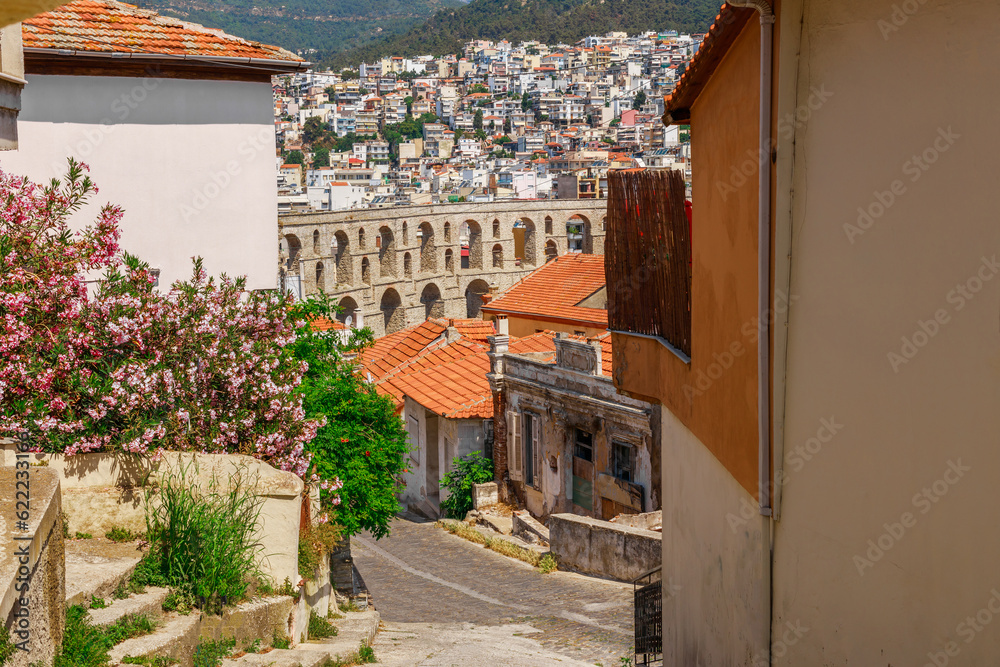 Ancient aqueduct and cityscape in Kavala, Macedonia, Greece, Europe