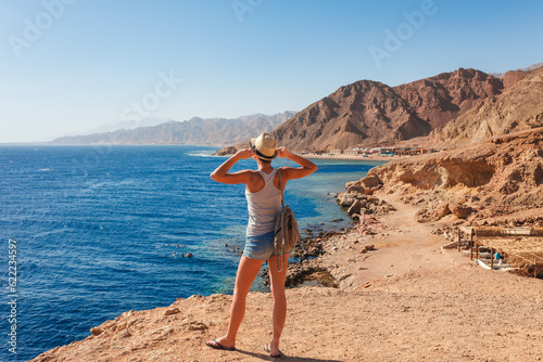 Tourist woman in Dahab near Blue Hole at the Red Sea coast, Egypt