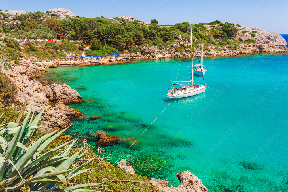 Sea skyview landscape photo Ladiko bay near Anthony Quinn bay on Rhodes island, Dodecanese, Greece. Panorama with nice sand beach and clear blue water. Famous tourist destination in South Europe