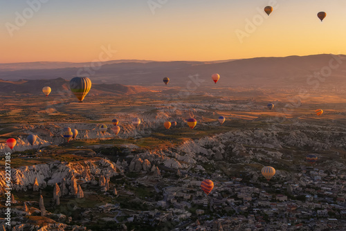 Aerial landscape of hot air balloons and rock formations of Cappadocia in Turkey
