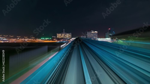 4K Hyperlapse of automatic train moving to city with out stop at station, Tokyo, Japan 
