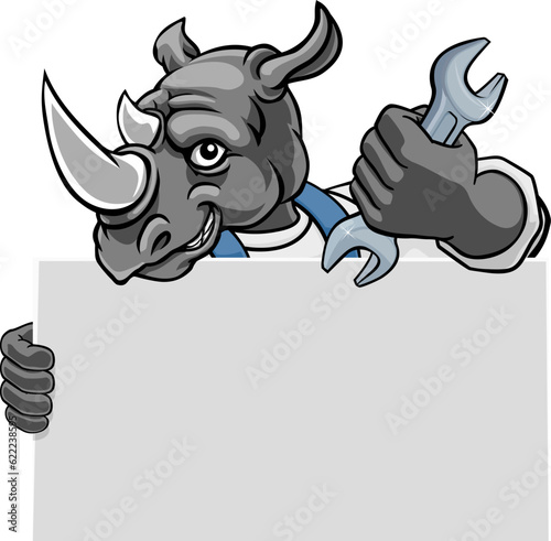 A rhino handyman, mechanic, plumber or other construction cartoon mascot man holding a wrench or spanner tool.