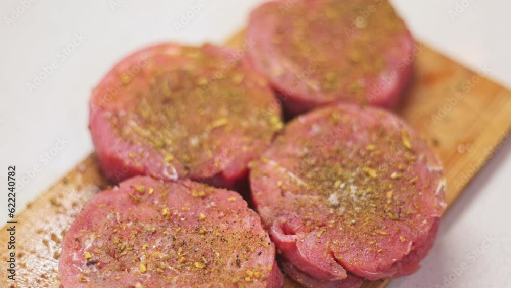 Tuna fillet marinated in spices on a light background. Tuna fillet marinated in spices on a light background.