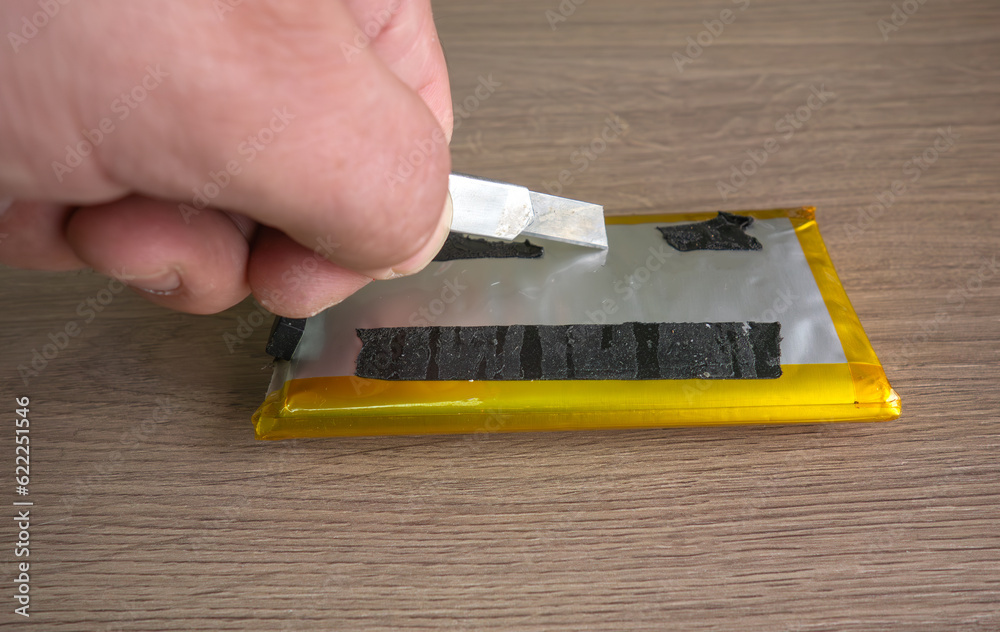 Pierce the swollen battery from the phone with a knife.Risk of fire