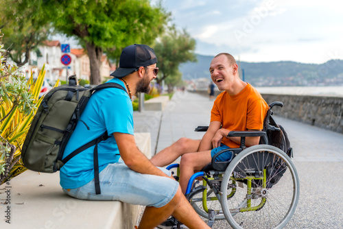 Bild auf Leinwand Disabled person in wheelchair with friends on summer vacation having fun