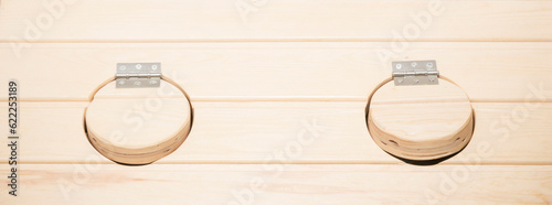 Cabinet for cosmetology procedures, rest and recovery with opened wooden phyto barrels for spa, wellness and skin care and human figure. Health and relaxation in beauty center