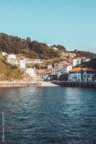 Cudillero, beautiful and touristic fishing village located in Asturias, vertical shot, copy space, travel concept, vacations, summer.