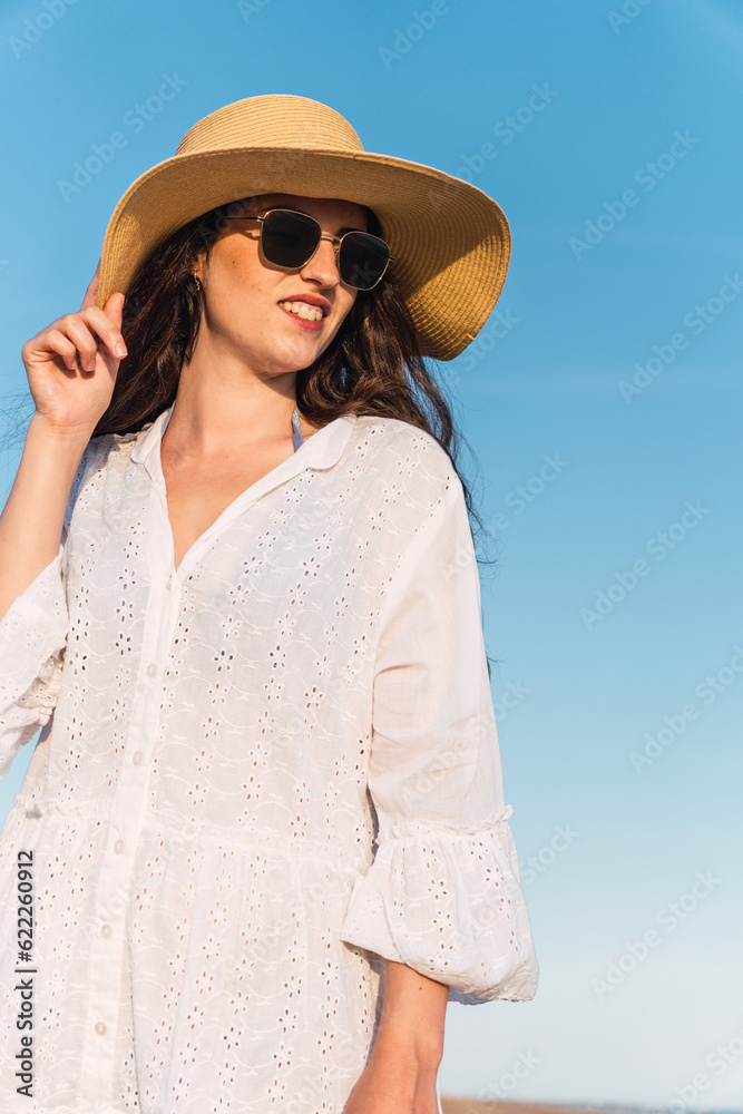 young woman smiling on the beach
