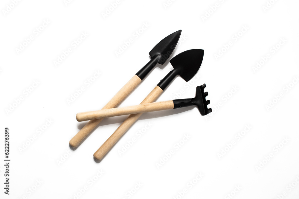 Wooden Gardening tools, shovel, rake on white background