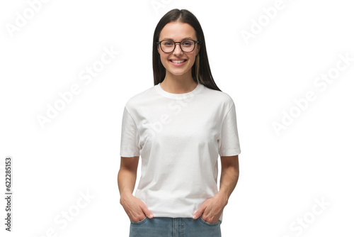 Young smiling woman standing with hands in pockets, wearing blank white tshirt with copy space