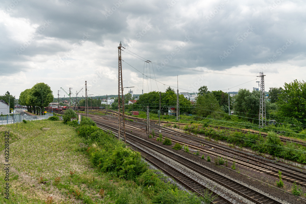 Access railroad tracks leading to the settlement. The sky is covered with clouds. Access railroad tracks leading to the settlement. The sky is covered with clouds.