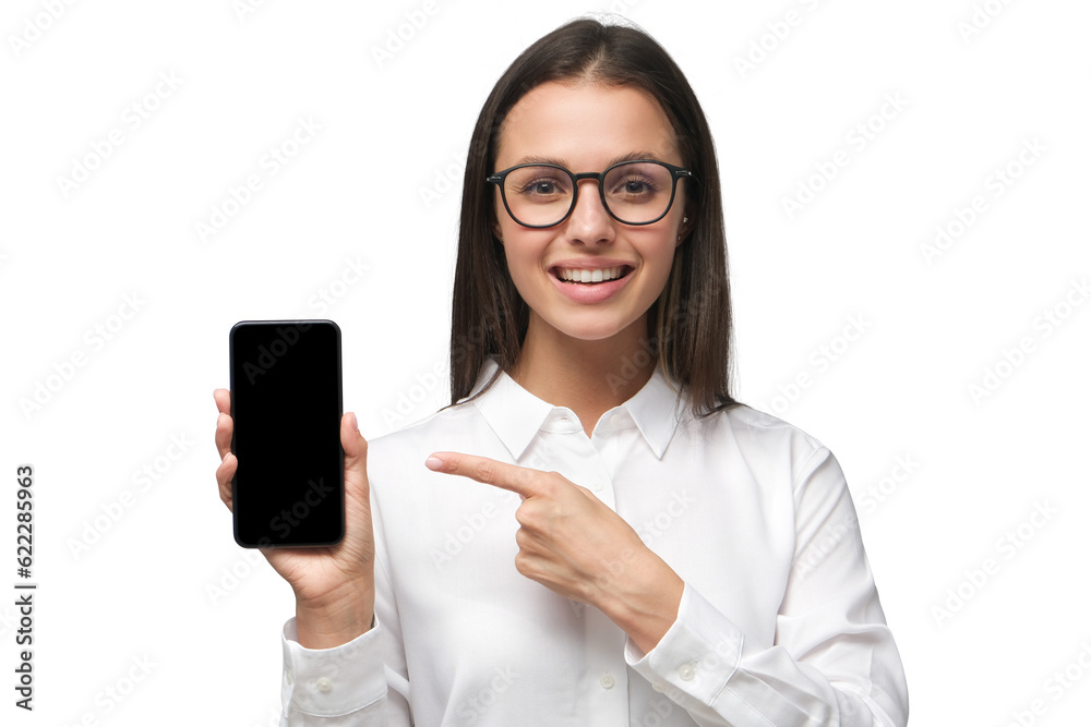 Businesswoman pointing finger at blank screen of phone with positive smile Businesswoman pointing finger at blank screen of phone with positive smile