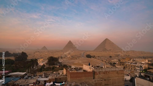 Timelapse of sunrise view of Pyramid complex of Giza, in Cairo, Egypt. photo