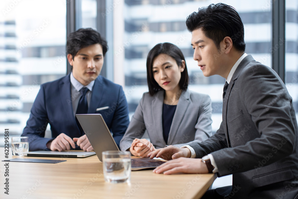 Confident Chinese business people having a meeting Confident Chinese business people having a meeting