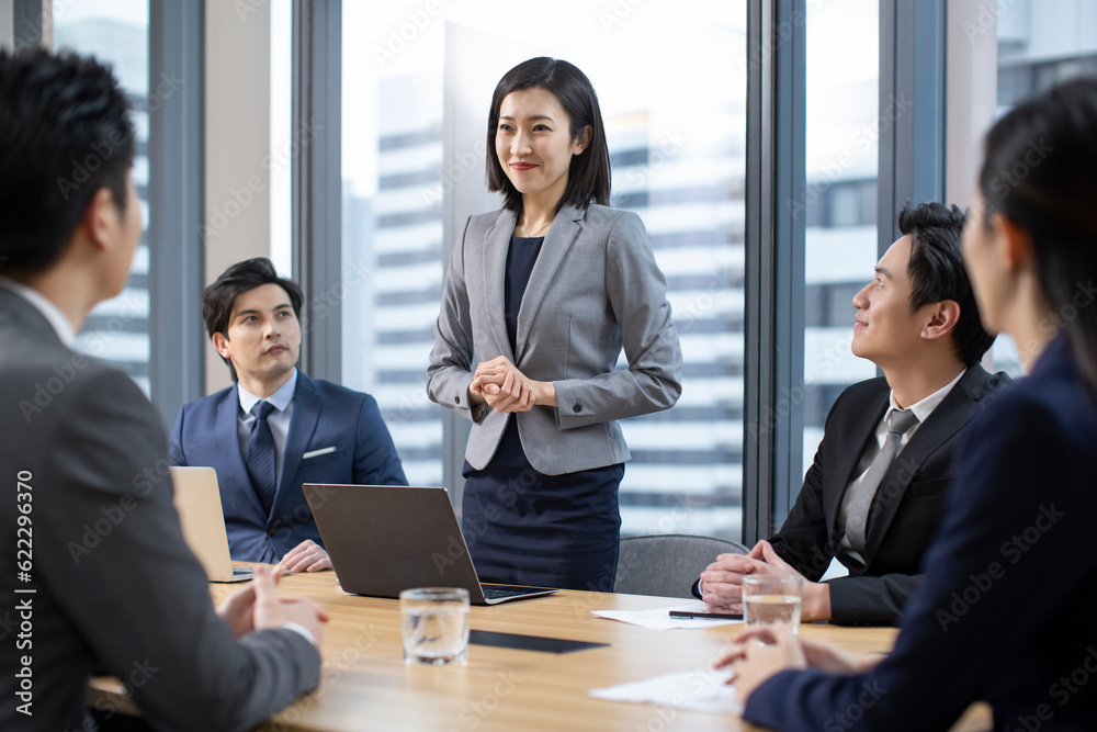 Confident Chinese business people having a meeting Confident Chinese business people having a meeting