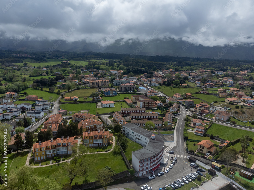 Obraz premium Vacation on Green coast of Asturias, aerial views of Celorio village with sandy beaches, North of Spain