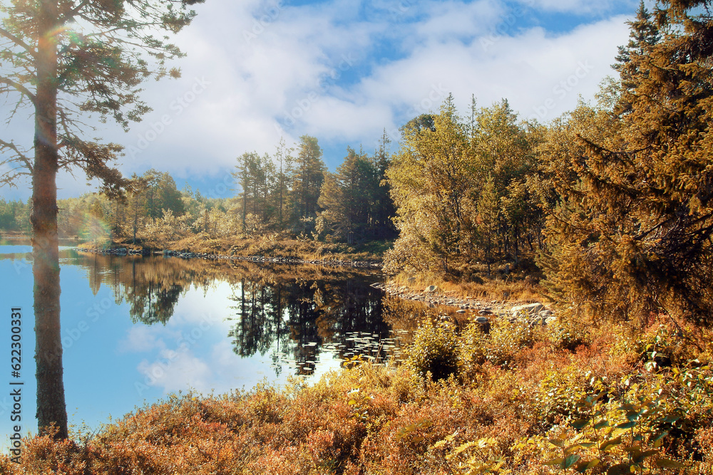 Autumn landscape with reflection in lake. Warm sunny day. Autumn landscape with reflection in lake. Warm sunny day.