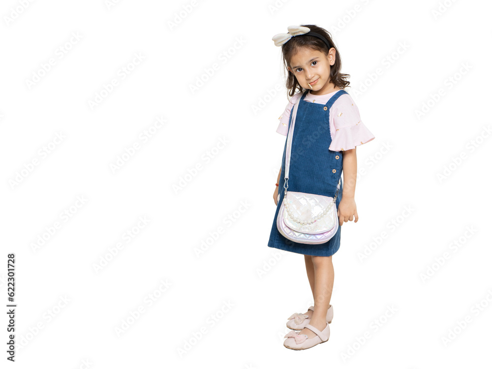 Little indian girl child wearing casual cloth and hand bag standing isolated over white background. Kids fashion portrait, Copy space. Little indian girl child wearing casual cloth and hand bag standing isolated over white background. Kids fashion portrait, Copy space.