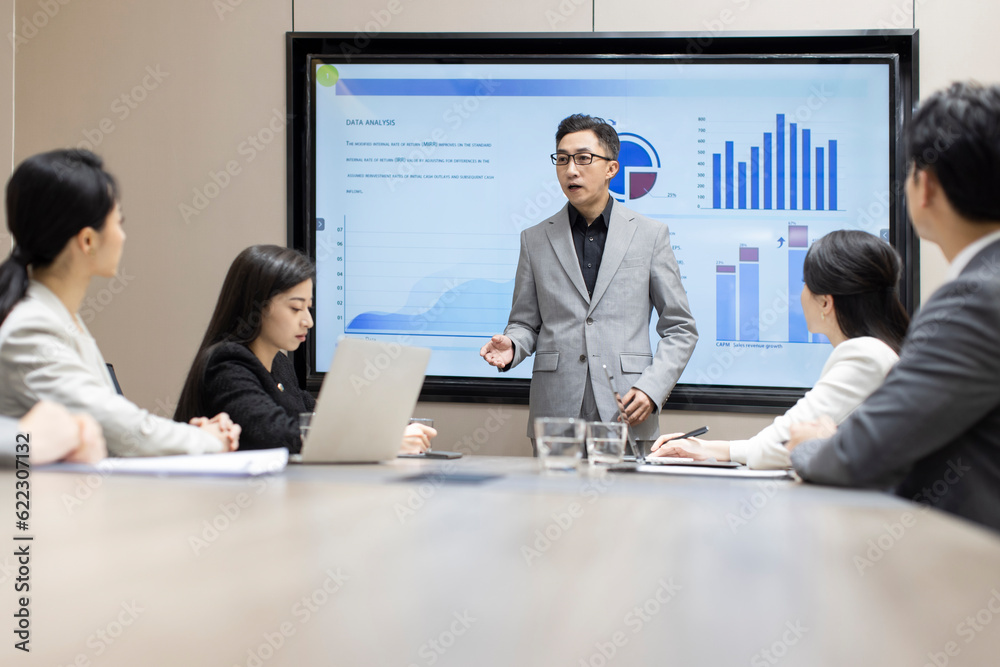 Confident Chinese business people having a meeting Confident Chinese business people having a meeting