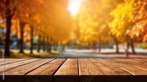 Empty wooden table top with blur background of autumn trees Park