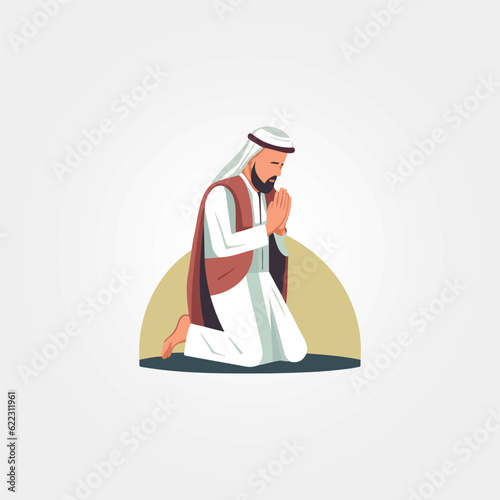 islamic man kneeling praying towards Meca photo