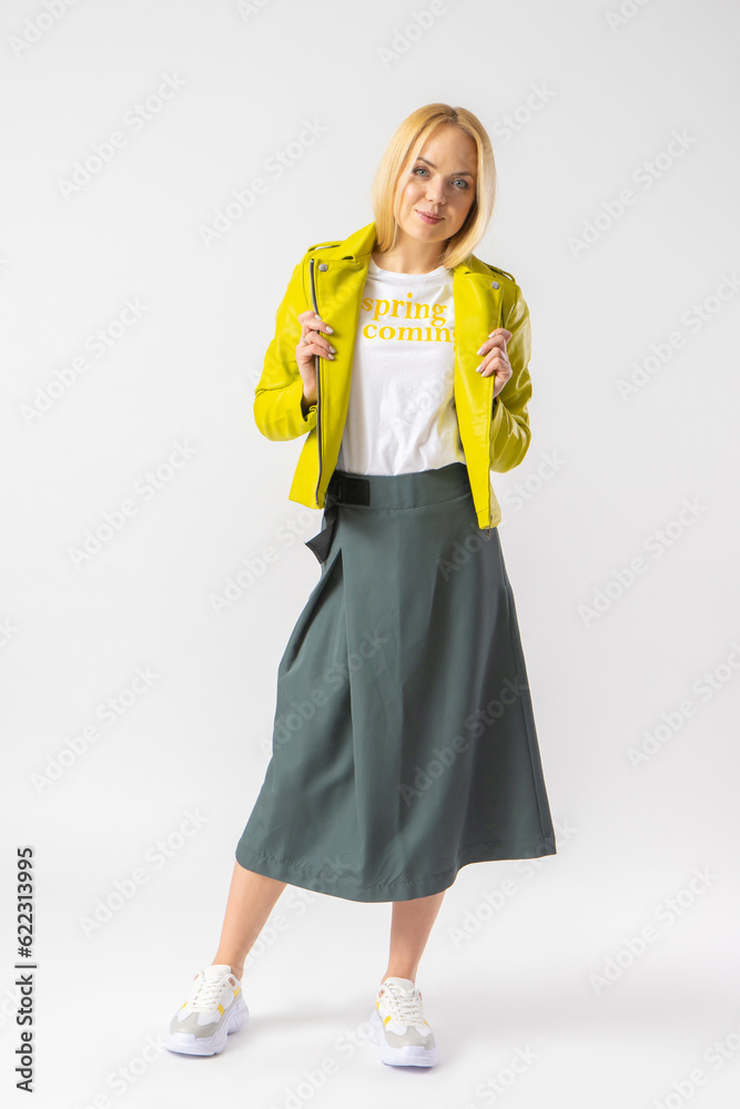 Woman in stylish youth casual skirt, leather jacket and white t-shirt Woman in stylish youth casual skirt, leather jacket and white t-shirt