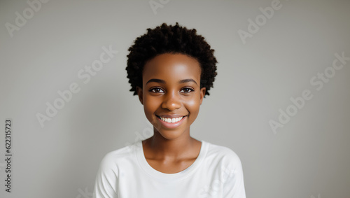 Portrait of cheerful black girl with short hair smiling at camera. Natural background with mockup. Generative AI. © Dawid