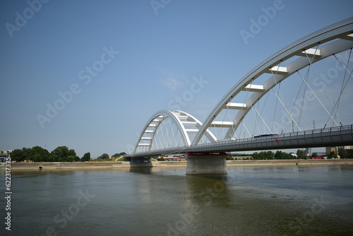 Fototapeta Naklejka Na Ścianę i Meble -  ˝Novi Sad, Serbia - 07 11 2023: Žeželj Bridge and Danube river on a sunny day˝