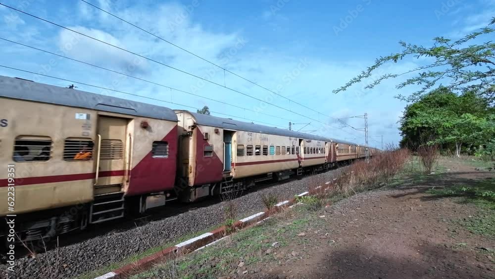 A passenger train hauled by a WDP4D  class diesel locomotive at Kedgaon near Pune India.