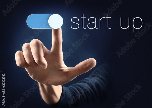 finger pointing a start up button