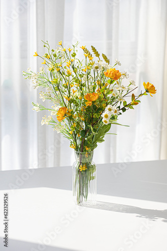 A small flower bouquet in a transparent vase