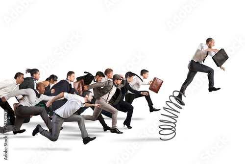 Businessman jumping on a spring during a race with opponents
