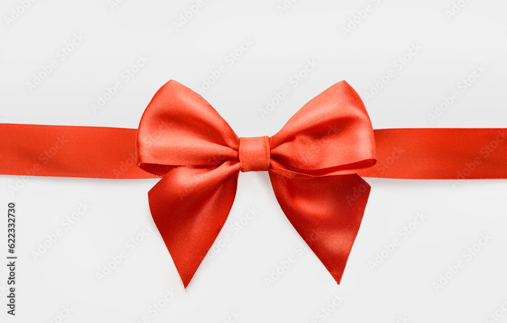 red satin bow on white background, whole object is cut with clipping path red satin bow on white background, whole object is cut with clipping path